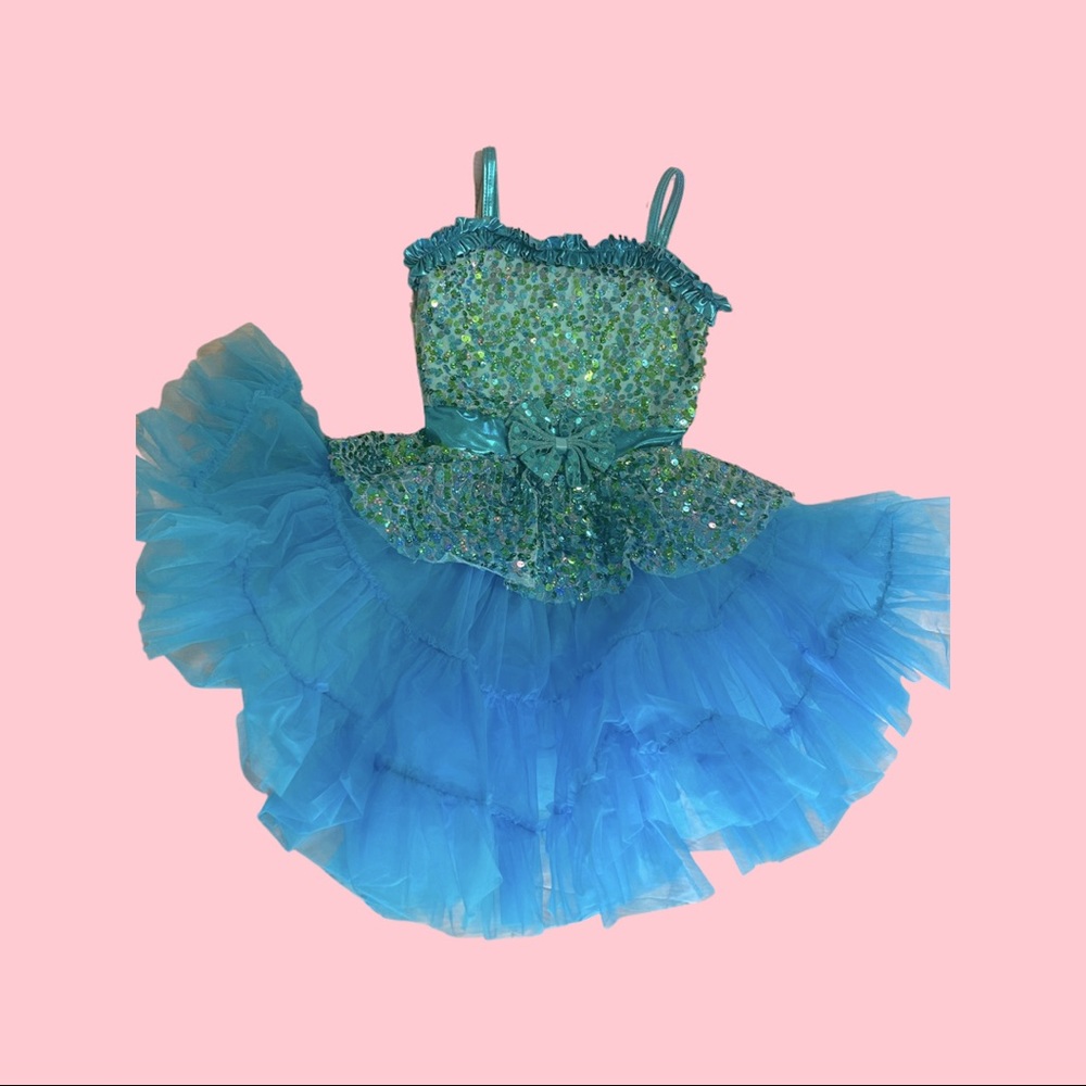 A wish come true blue sequin leotard with detachable ruffle skirt.